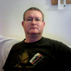 Man in a T-Shirt Sitting