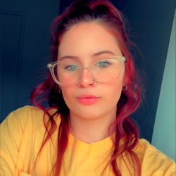 Stylish Woman in Yellow Shirt with Glasses