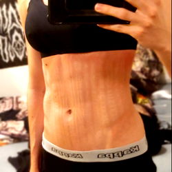 Fitness Model Showcasing Abs and Underwear