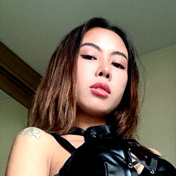 Mistress Alessia: An Onlyfans Model in a Seductive Pose