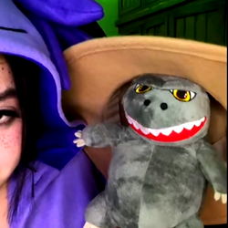 Onlyfans Model AcidGelipe in Cosplay, Holding Stuffed Monster and Posing for Picture