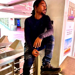 Kyym on Escalator with Casual Style