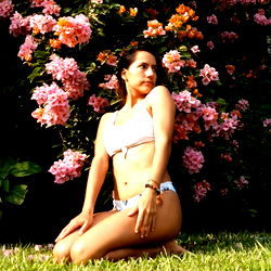 Model Pose in Garden, Near Flowers and Bush
