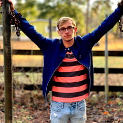 Young Man in Striped Shirt with Jacket and Chain