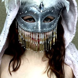 Amber Len in a Mask and Gown