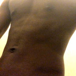 Fit and Shirtless Man in Bathroom