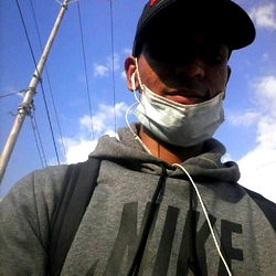 Man in Face Mask on Street