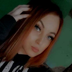 Woman with Red Hair and Short Bangs