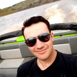 Daniel Kennedy in a boat on a lake