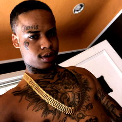 Candid Moment of a Tattooed Man in Hip Hop Style