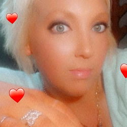 Blonde Woman with Short Hair and Heart-Shaped Earring