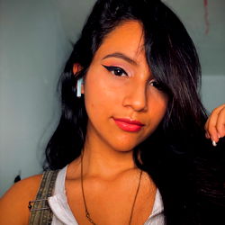 Beautiful and Stylish Young Lady in Selfie with Phone Background