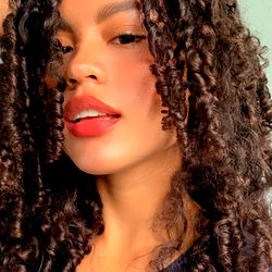 Casual Female with Curly Hair and Red Lipstick