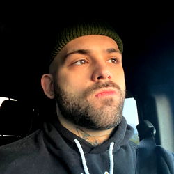Onlyfans Model Joe: A Sweatshirt-Wearing Guy in a Vehicle