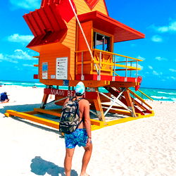 Tourist admiring lifeguard tower on beach