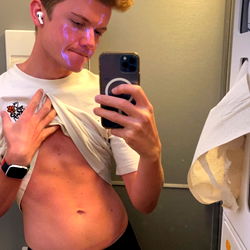 OnlyFans Model Naughty Boy Posing with Shirt Off and Finger on Stomach