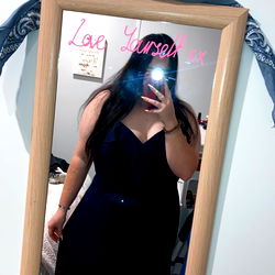 OnlyFans Model Adele in Black Dress Capturing Selfie