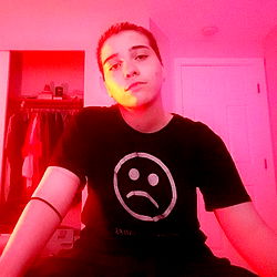 Charles, a young adult, exudes confidence and charisma in this vibrant photo.