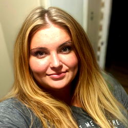 Auburn-haired woman with a striking gaze