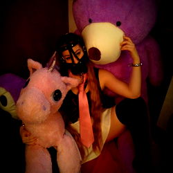 OnlyFans Model Posing With Stuffed Animals and Unicorn