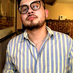 Alan Lerma, a young man with glasses and beard