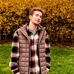 Adresex, a young man in a flannel shirt