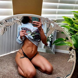 Rose on OnlyFans: A Model Posing for a Mirror Shot