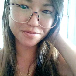 Rose, a Hawaii-based model with glasses and a relaxed pose