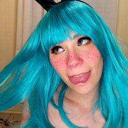 Stylish OnlyFans Model Posing in Vibrant Blue Wig