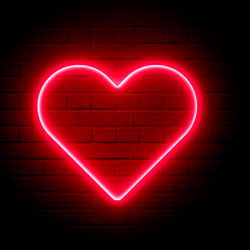 Heart-Shaped Neon Sign on Brick Wall