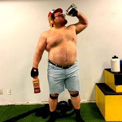 Papa Don, OnlyFans Model, Celebrates his Success with a Beer Bottle