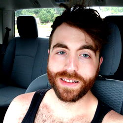 Bearded Man in a Car