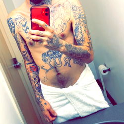 A model showcasing a tattooed body