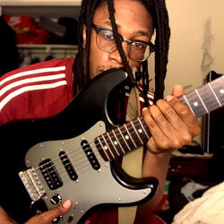 A Black Man on a Mission with Guitar, DMV