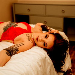 Chelle: OnlyFans Model Posing for Photograph