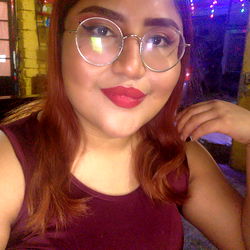 Beautiful Woman in Glasses and Red Lipstick