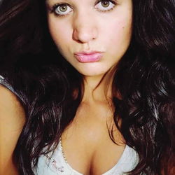 Ashley, a young woman with captivating eyes and wavy hair