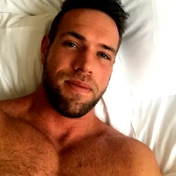 Muscular Man with Tattoos in Bed, OnlyFans Model Alexander Mecum