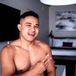 A Model in Las Vegas, Shirtless with a Playful Expression