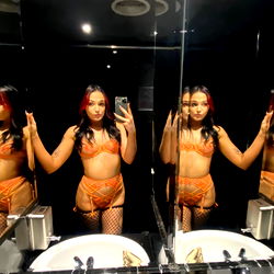 Model in Bathroom Mirror