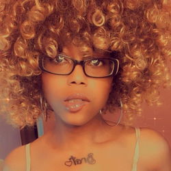 Female Individual with Blonde Hair and Tattoos