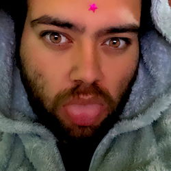 Bearded Man with Tattoo in Hoodie