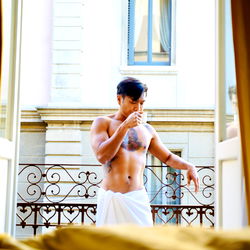 Stylish Male Model Taking a Break with Coffee