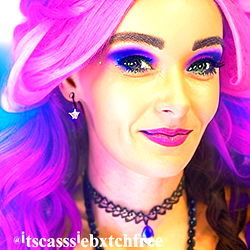 Purple-haired person in makeup