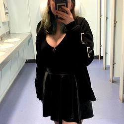OnlyFans Model Lulu in Stylish Black Skirt and Dark Shirt, Standing in Bathroom