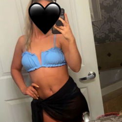 Model in Bikini Strikes a Pose in Bathroom