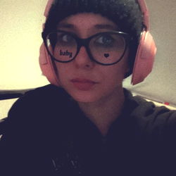 Awkwardpolly: Young Female with Ear Muffs and Headphones, Smiling for Onlyfans