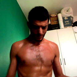 A Shirtless Man in a Kitchen