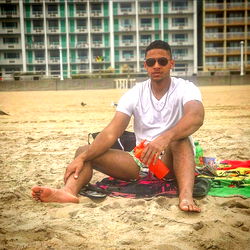 Ares, the Fitness Model, Relaxes on the Beach