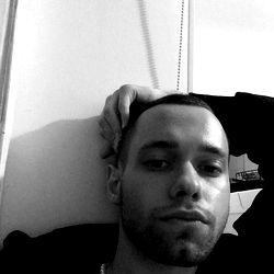 Max, a young man with cropped hair, poses casually for the camera.